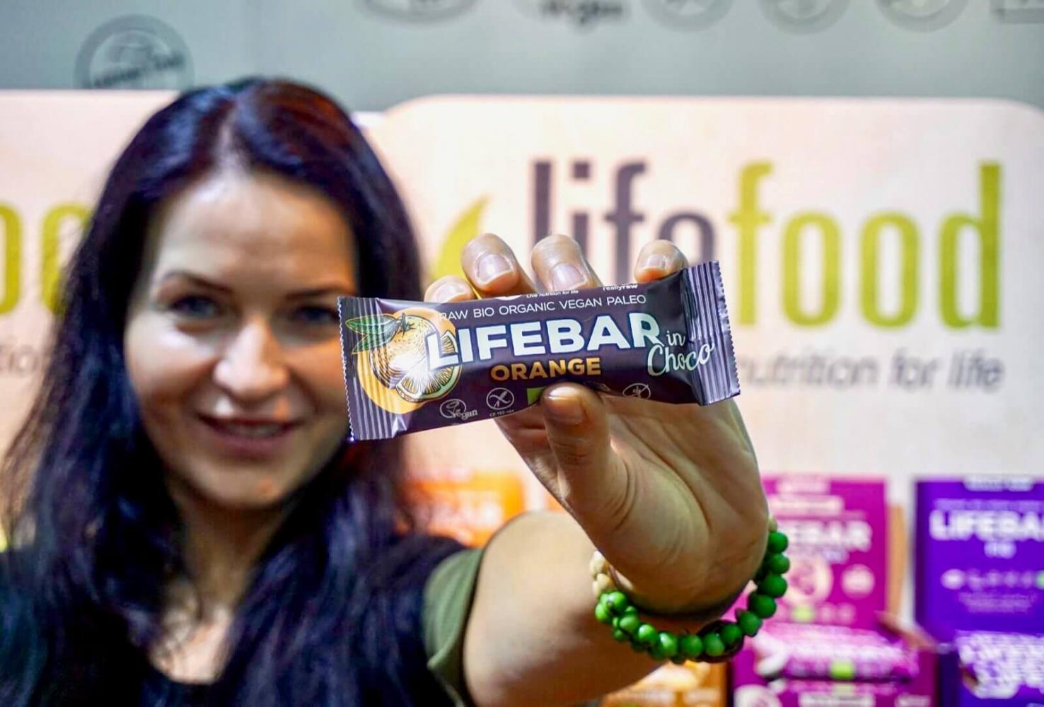 Lifefood owner Tereza is showing a new product - Lifebar coated with chocolated